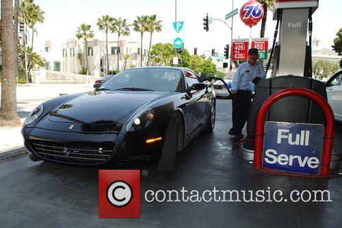 Sylvester Stallone fills up his Ferrari with gas