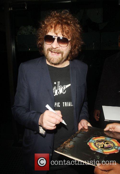 Jeff Lynne of ELO signs autographs whilst leaving