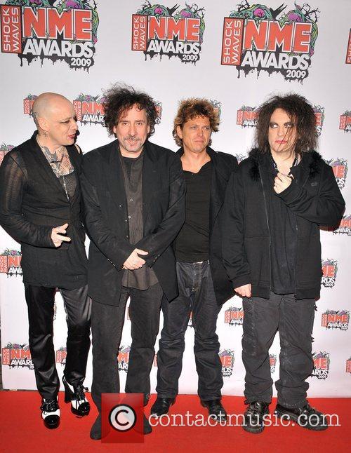 The Cure alongside Tim Burton at the 2009 NME awards where they recieved the Godlike Genius award