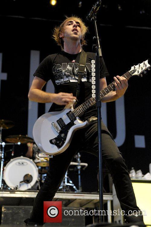 Alex Gaskarth of All Time Low performing live