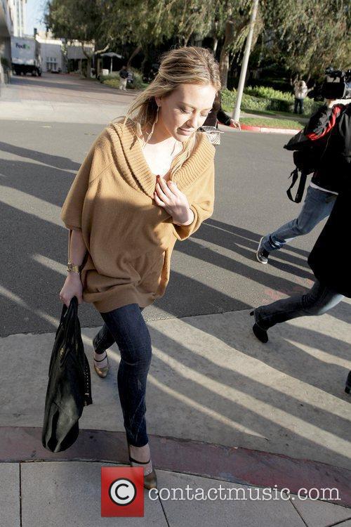 Hilary Duff shopping in Beverly Hills while wearing a 
camel sweater