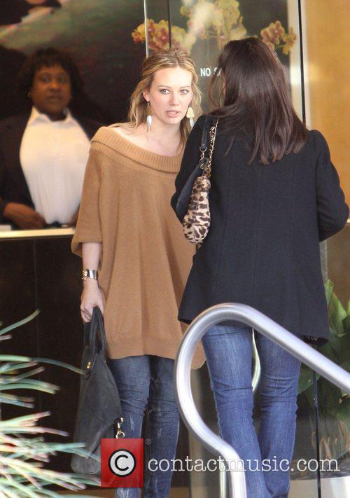 Hilary Duff shopping in Beverly Hills while wearing a 
camel sweater