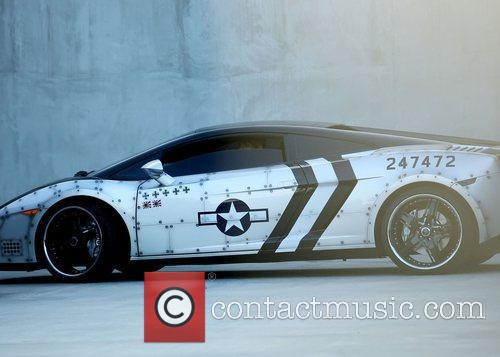 Chris Brown waits in his customized Lamborghini Gallardo