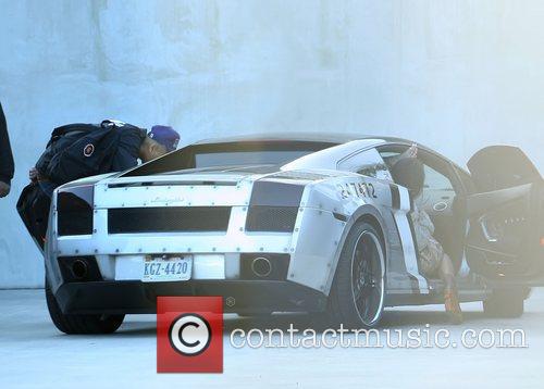 Chris Brown waits in his customized Lamborghini Gallardo