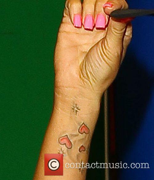 Katie Price sporting a new tattoo on her