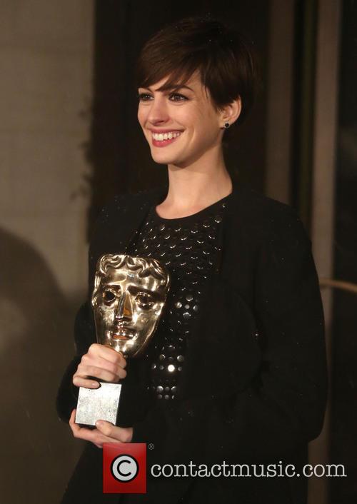 Anne Hathaway Clutches Her BAFTA for Les Miserables