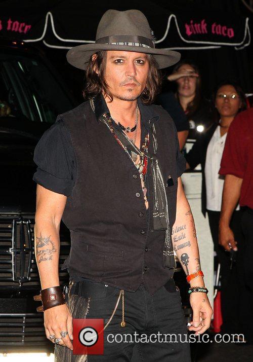  Johnny Depp arrives at Aerosmith party 