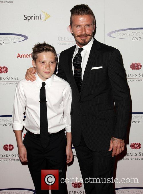 Brooklyn Beckham and father David