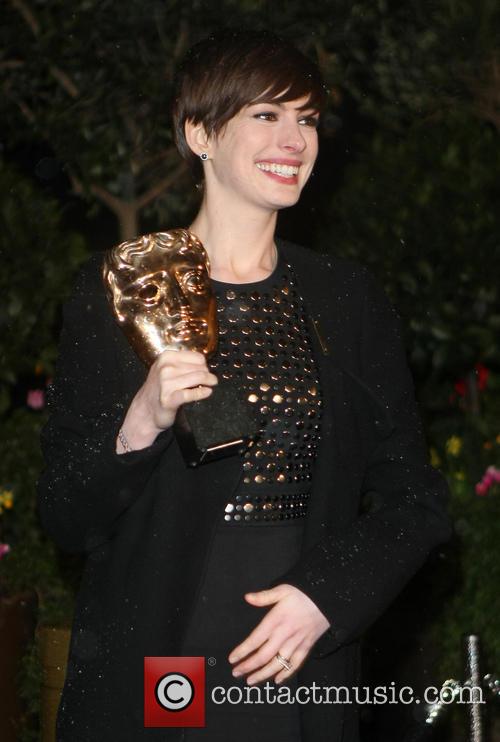 Anne Hathaway Clutches Her BAFTA for Les Miserables
