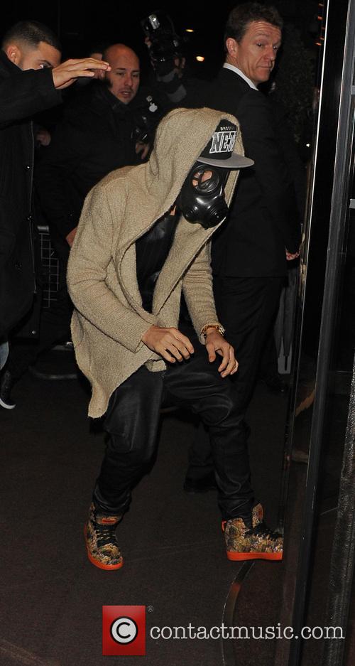 Justin Bieber wears a gas mask