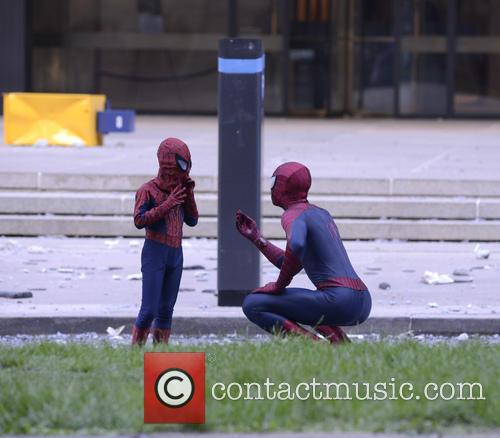 Spider Man talks to his smaller counterpart