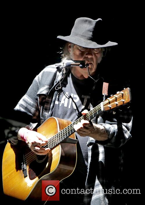 Neil Young performing live in Leeds