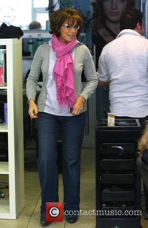 Natasha Kaplinsky Wearing A Bright Pink Scarf Leaving After A Visit To Her
