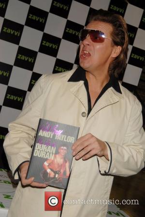 Andy Taylor Of Duran Duran Signing Copies Of His New Book'Wild Boy'
