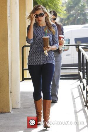 Busy Philipps stops by Starbucks to get a large iced coffee
