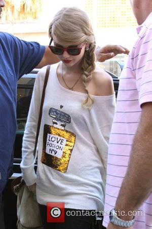 Taylor Swift , sporting red frame wayfarer sunglasses, out shopping in Beverly Hills