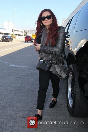 Picture Demi Lovato arriving at LAX Airport for a flight Los Angeles Fake
