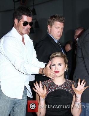 Demi  Simon on Simon Cowell   Simon Cowell Praises Demi Lovato S Recovery