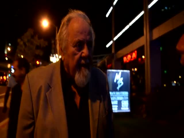 Director George Schlatter talks to the paparazzi outside Boa Steakhouse