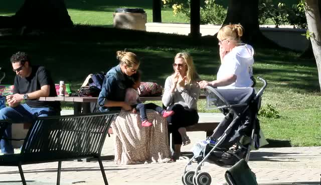 Heidi Klum wearing a light brown maxi dress and denim jacket, spends time with family and friends in a park - Part 1