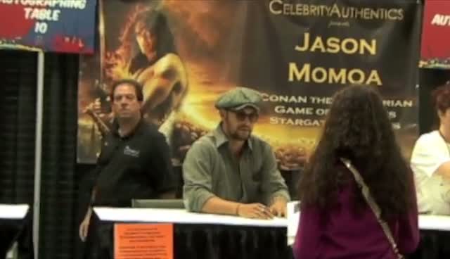 Jason Momoa Signs Poster For Lucky Fan