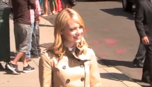 Emma Stone Arriving And Leaving 'David Letterman' In Nude Trench Coat