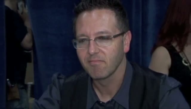 John Edward Poses With 'Fallen Masters' At New York Book Expo