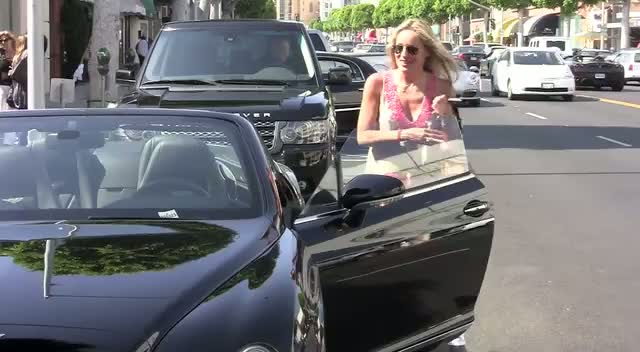 Sharon Stone Smiles For Cameras Before Jumping Into Her Bentley