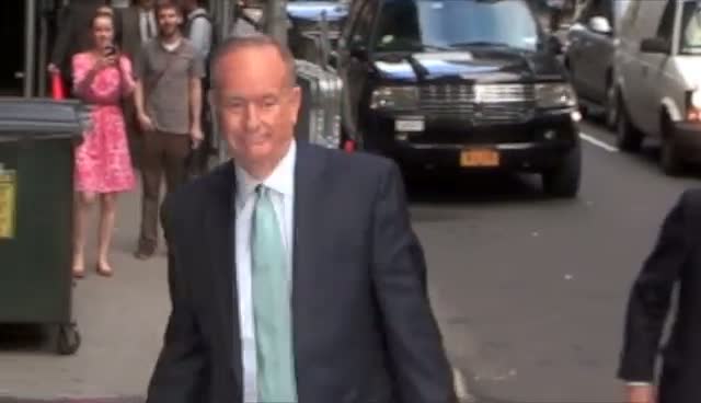 Bill O'Reilly Hurries Past Photographers Outside Letterman Show