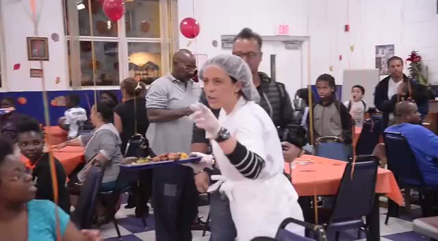 Chris Bosh Helps Out In A Local Kitchen To Feed The Nearby Families