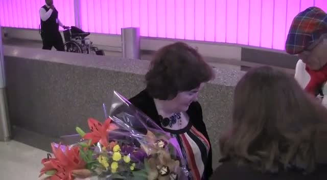 Susan Boyle Greets Fans And Photographers On Arriving At LAX