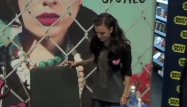 Cher Lloyd Shows Off Graffiti Jacket Design At Autograph Signing