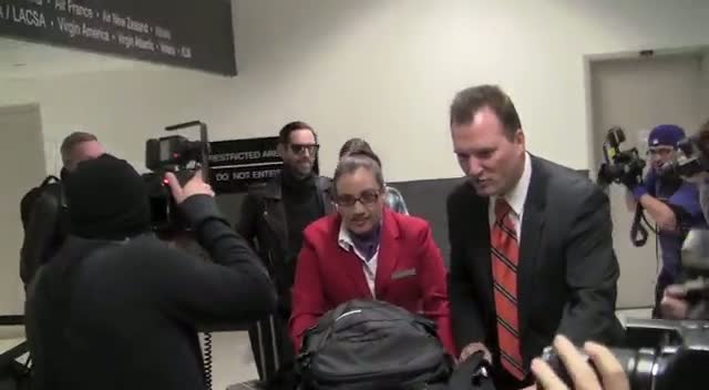 Kate Bosworth Signs An Autograph For A Fan On Arriving At LAX With Fiance Michael Polish