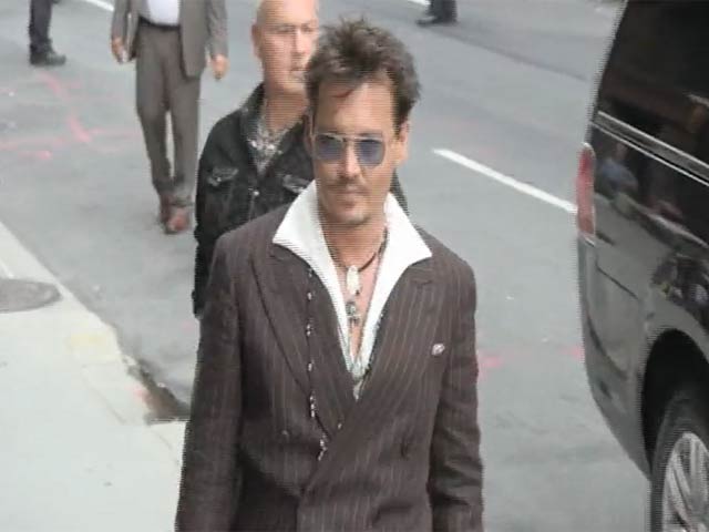 Johnny Depp Shakes Hands With Radioman On Arriving For 'Letterman'