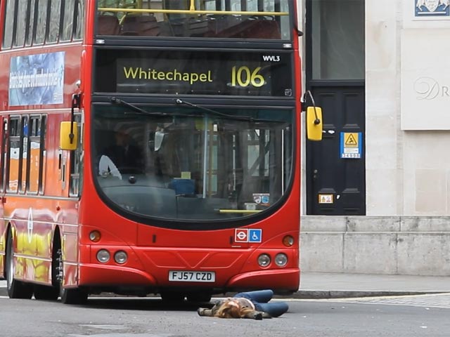 Emily Berrington Lies In Front Of A London Bus On Film Set Of '24: Live Another Day - Part 3