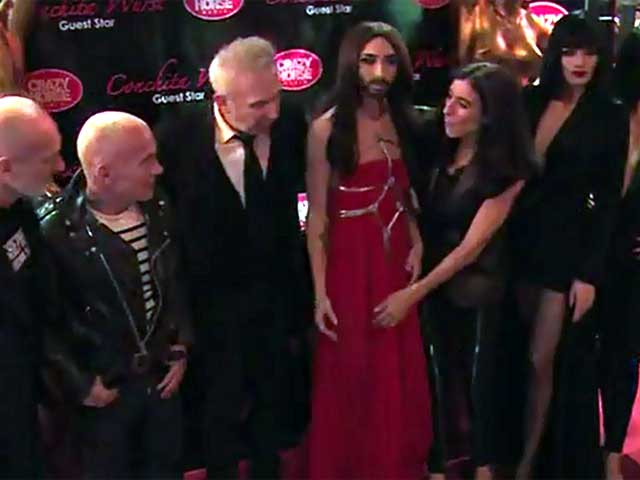 Conchita Wurst Poses With Cabaret Troupe At The Crazy Horse Saloon
