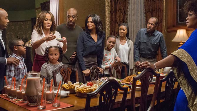 The family gather around the dining table in Almost Christmas