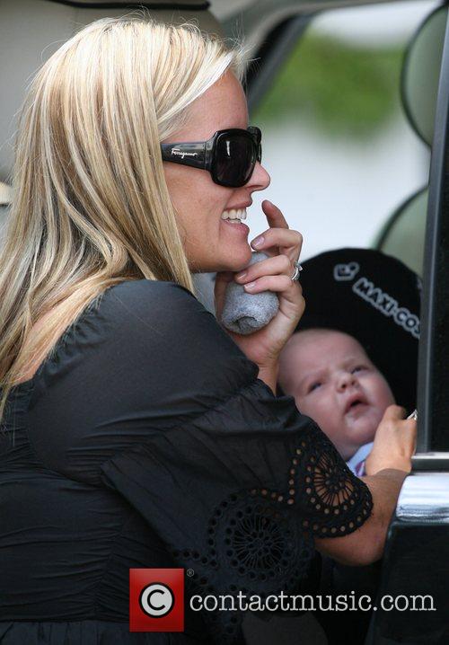 Davinia Taylor - Davinia Taylor leaving her house with her baby son ...