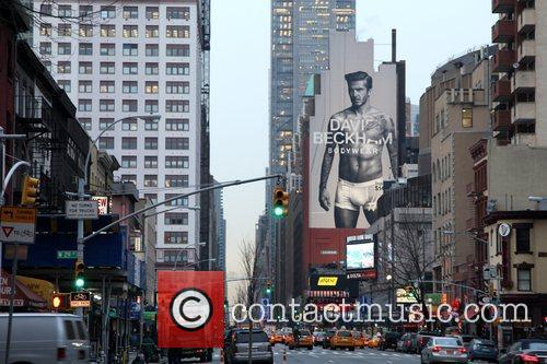 David Beckham - appears on a giant billboard in Manhattan to promote ...