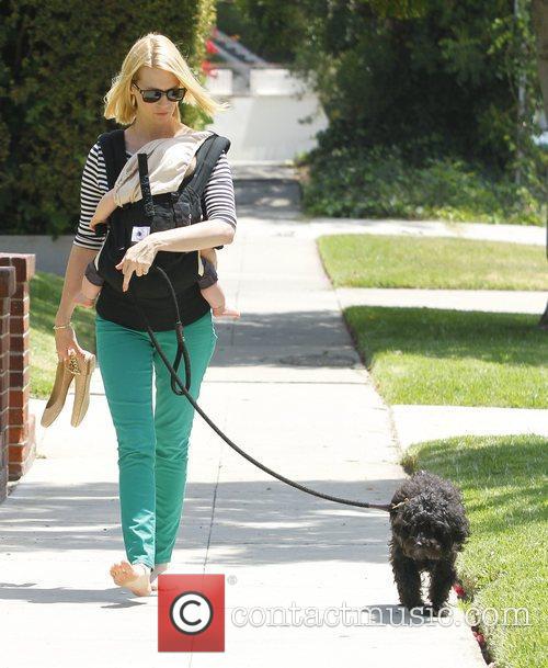 January Jones - walks her dog barefoot whilst carrying her son Xander ...