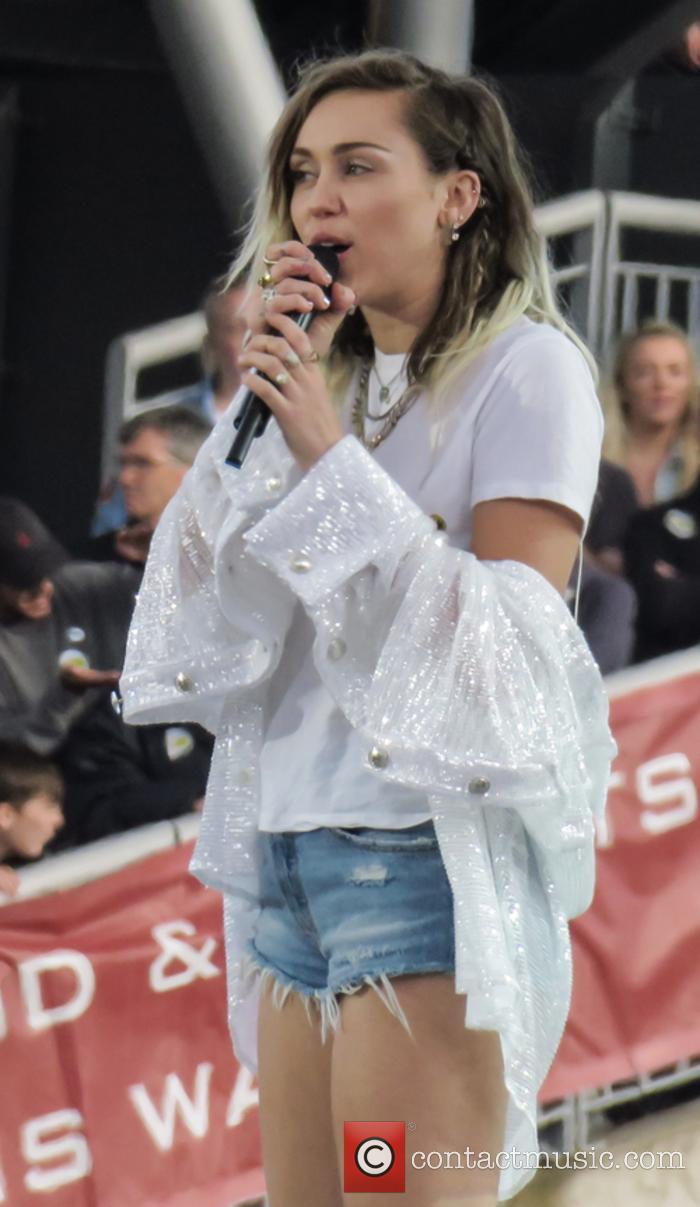 Miley Cyrus performing at One Love Manchester