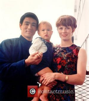 Bruce Lee with his son Brandon Lee and wife Linda Lee USA - Circa 1966