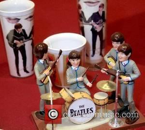 Beatles merchandising stage set and plastic beakers at the Rock 'N' Roll celebrity memorabilia Fame Bureau auction at the Orleans...