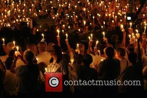 Thousands of fans attending the candlelight vigil in Graceland, Memphis to mark the 30th anniversary of the death of Elvis...