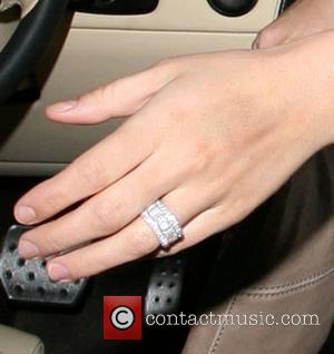 Danielle Lloyd wearing a ring on her engagement finger at Andy Scott-Lee's launch party to release his new single, 'Unforgettable'...