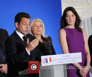 French president Nicolas Sarkozy and wife Carla Bruni  French President Nicolas Sarkozy delivers a speech at the French Embassy...