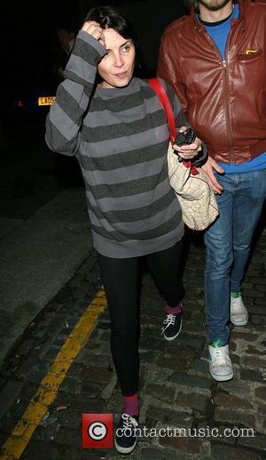 Sadie Frost arrives at the home of Amy Winehouse with a group of friends at 2am, looking rather worse for...