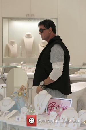 Sylvester Stallone walking around Beverly Hills where he bumps into Tom Arnorld Los Angeles, California - 16.02.08