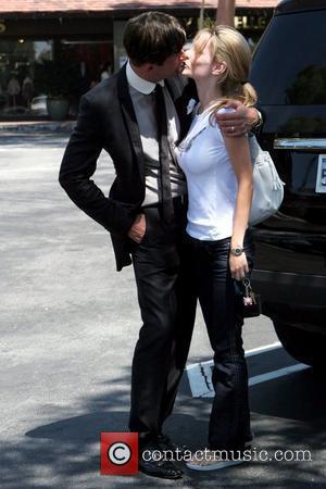 Dr. Robert Rey and Hayley Rey share a romantic moment while out and about in Beverly Hills Los Angeles, CA...