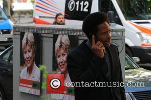 Gary Dourdan uses a mobile phone at the set of the movie Fire in Charlottenburg Berlin, Germany - 30.08.08